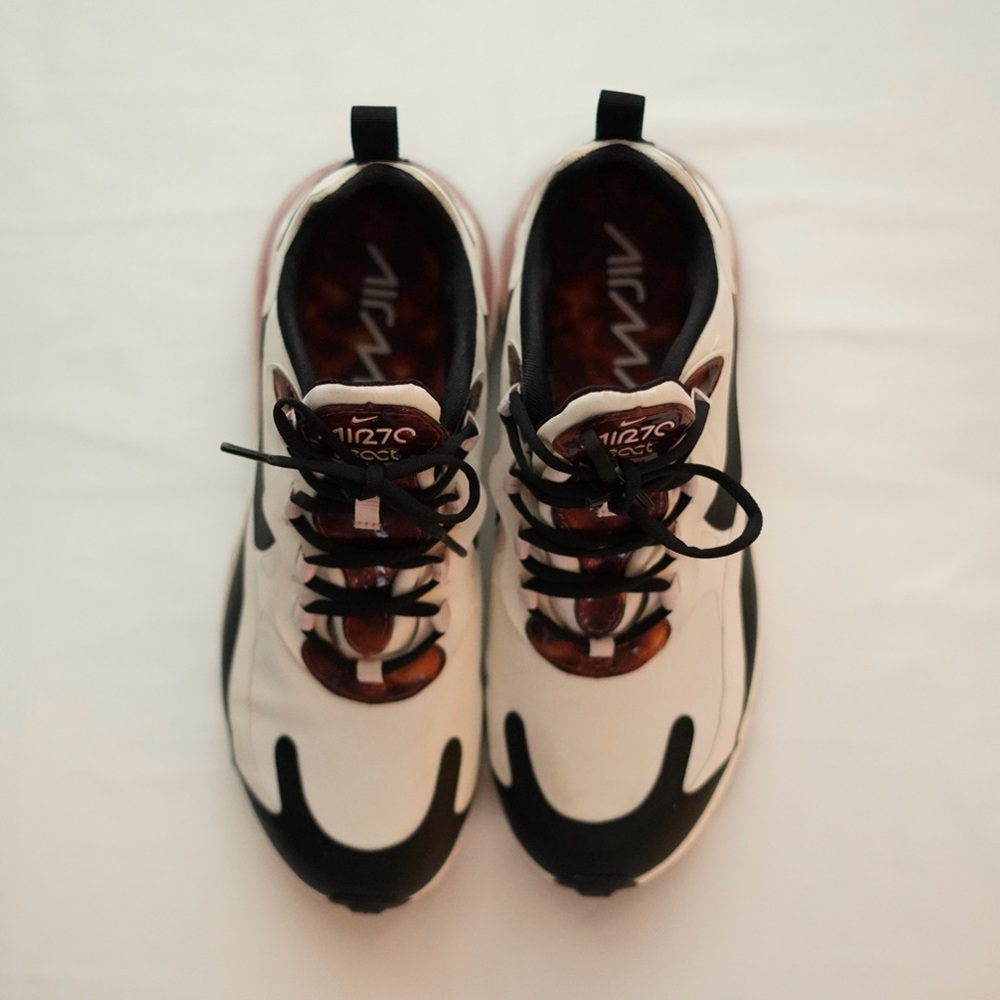 Nike with tortoise.